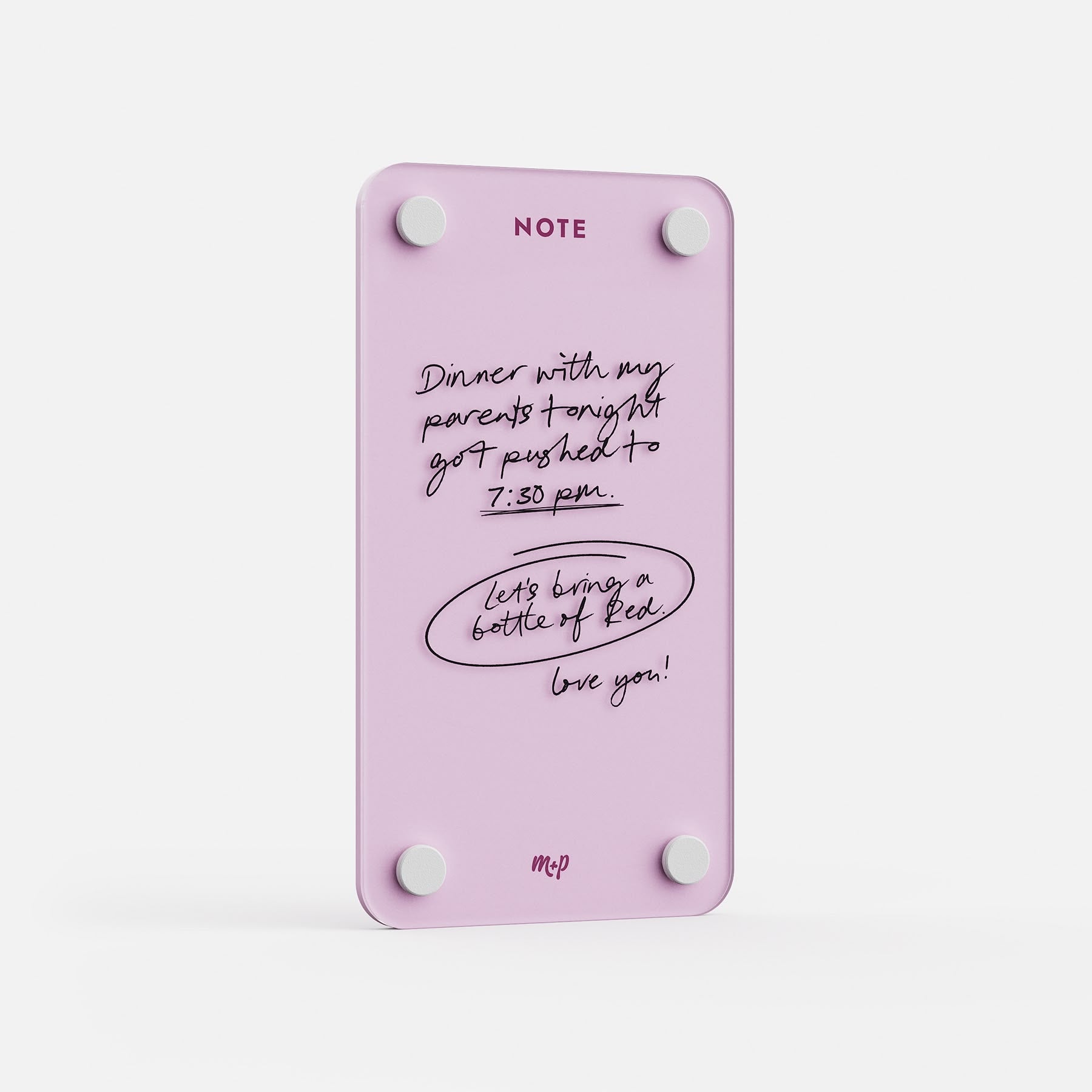 Angled view of a Ballet pink tall magnetic acrylic note board with a handwritten note to a partner
